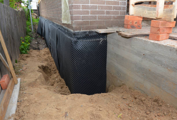 Happy homeowners after waterproofing job in Clifton